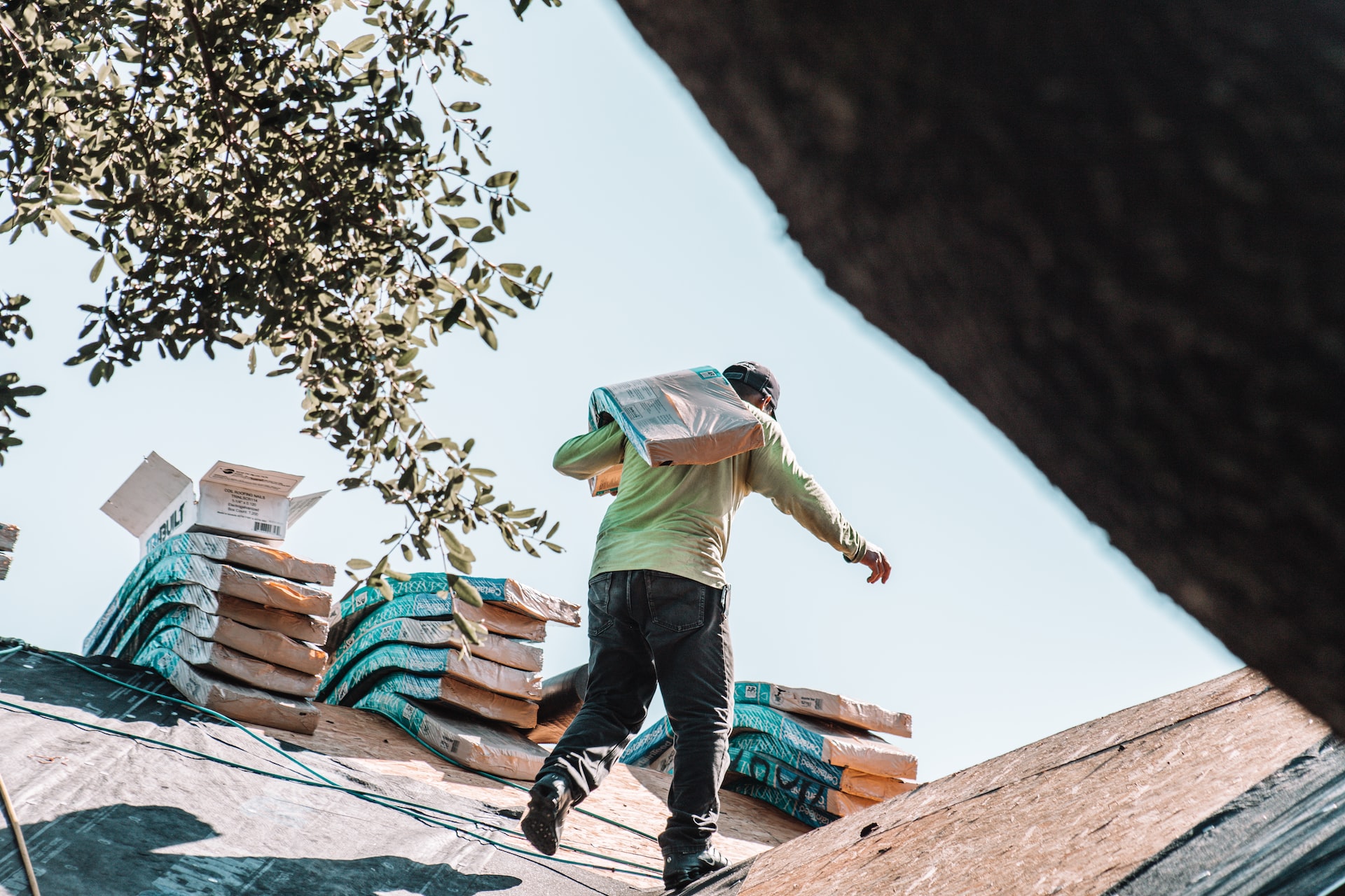 A roofer installing a roof.