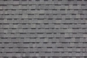 Close up image of dark asphalt roof shingles