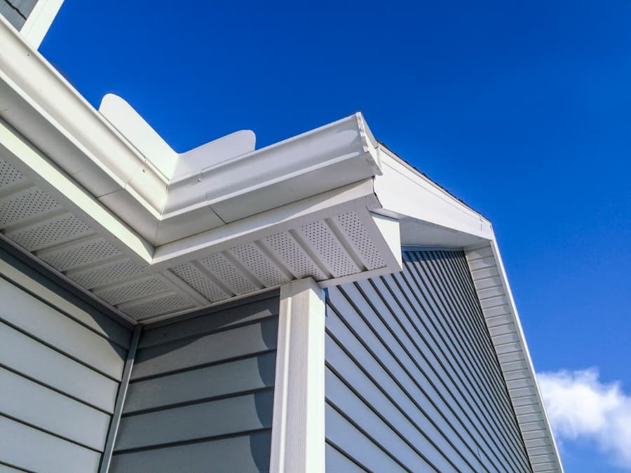 Low-angle view of a new house with vinyl siding